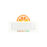 A reusable acrylic name badge in white, featuring a vibrant orange slice design and an area for custom text.
