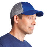 A blue Lo-Pro Mesh Trucker Cap with a grey mesh back, worn by a man. The cap features a logo.