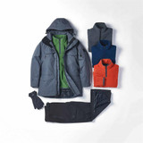 A grey jacket with a hood, paired with a green fleece, blue and orange jumpers, and black pants, plus gloves.