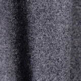 A close-up of a grey textured fabric, showcasing a soft knit material with subtle variations.
