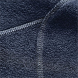 A close-up of a navy blue polar fleece jacket showcasing the textured fabric and detailed stitching.