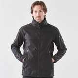 A men's black softshell jacket with a full zip, featuring zippered pockets and a stand-up collar.