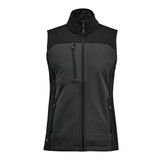 A women's softshell vest in dark green and black, featuring a high collar and multiple zippered pockets.