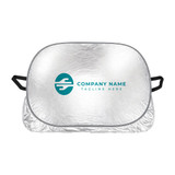 A silver aluminium car snow cover with handles and a logo printed on the front.