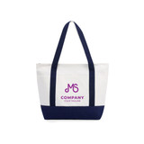 A medium canvas tote bag in white and navy, featuring a logo on the front with dual handles.