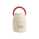 A stainless steel vacuum insulated food jar in cream with a red handle, featuring a logo on the front.