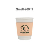 A double wall paper cup with a peach sleeve, featuring a logo and text for a coffee shop.