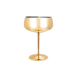 A stainless steel cocktail coupe in a shiny gold finish, featuring a tall stem and round base.