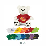 A white bear plush toy wearing a red shirt, surrounded by various small t-shirts in different colours.