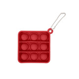 A red square fidget keychain with eight bubble sections and a silver chain attachment.