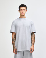 A grey unisex pique mockneck t-shirt with short sleeves and a logo.