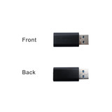 A USB data blocker in black, showcasing the front and back views of the device.