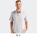 A grey polo shirt with a three-button placket and a logo. The model is smiling while standing against a plain background.