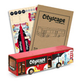 A wooden bus model in red and blue, featuring various city landmarks and a logo on the side, alongside design sheets.