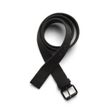 A black cotton webbing belt laid out flat, featuring a metal buckle and several adjustment holes.