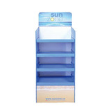 A premium cardboard floor display in blue, featuring multiple shelves for product placement and a logo.