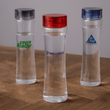 A drink bottle featuring a clear body with three different coloured lids: red, blue, and silver. Each has a logo.
