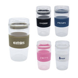 A collection of reusable coffee cups in various colours with silicone grips and lids, featuring different logos.