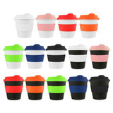 A collection of reusable coffee cups in various colours including white, pink, red, orange, green, blue, and black, each with a silicone band and lid. A collection of reusable coffee cups in various colours including white, pink, red, orange, green, blue, and black, each with a silicone band and lid.