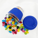 A blue reusable coffee cup made of glass, surrounded by colourful jelly beans and a matching lid. A blue reusable coffee cup made of glass, surrounded by colourful jelly beans and a matching lid.