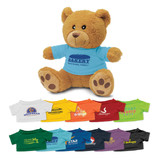 A teddy bear plush toy with a light blue shirt. It has a brown fur body and various colourful shirts below it.