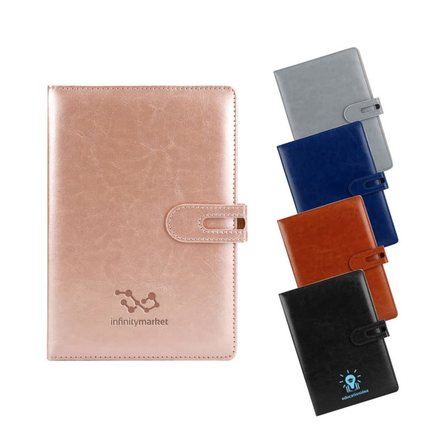 A collection of Ceo PU Notebooks in various colours: rose gold, grey, navy, brown, and black, each with a button closure and logo.