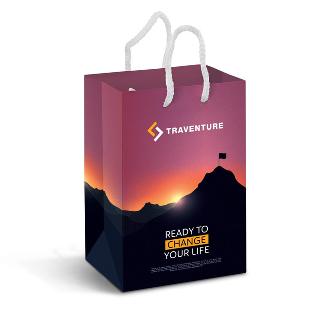 A small laminated paper carry bag in vibrant purple and black, featuring a mountain landscape and a logo.