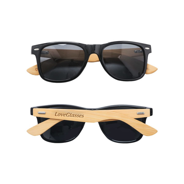Bamboo sunglasses featuring black lenses and natural bamboo arms, with a logo on one side.