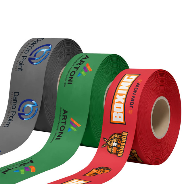 Three rolls of ribbon in grey, green, and red, featuring various logos and designs.
