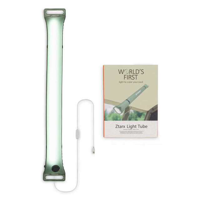 A foldable camp light in green with a white charging cable and a product box featuring a logo.