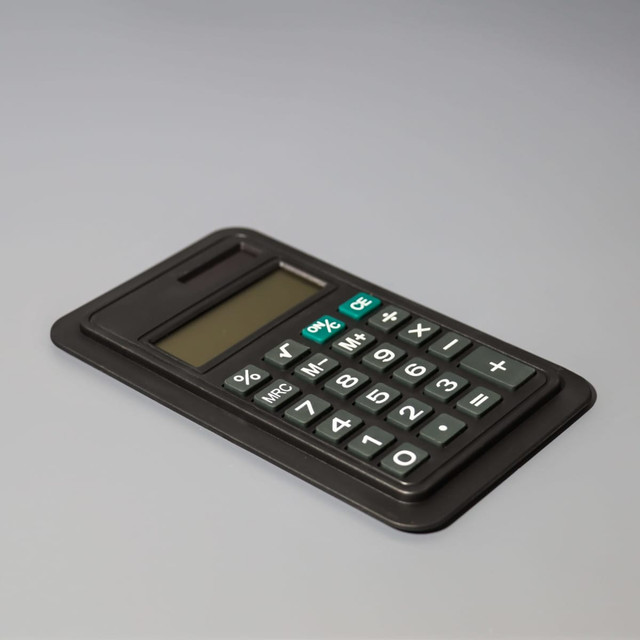 A black calculator with an LCD display and a full set of numeric buttons, featuring a logo.