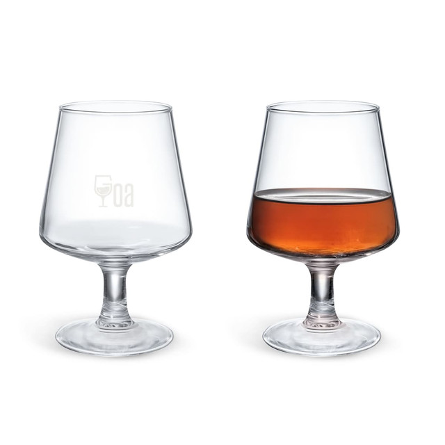 A brandy snifter in clear glass, with one empty and one filled with amber liquid, featuring a logo.