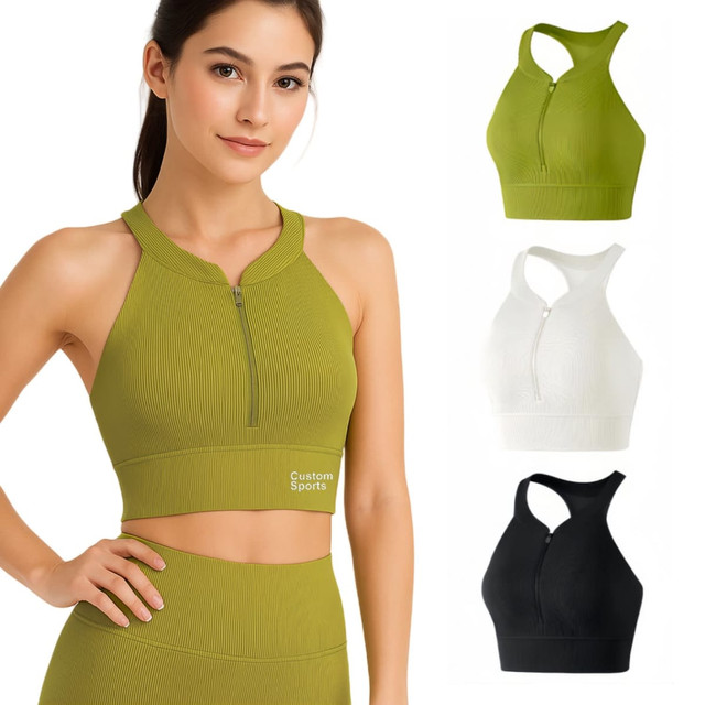 A women's zip-front racerback yoga crop bra tank in olive green, white, and black, featuring a logo.