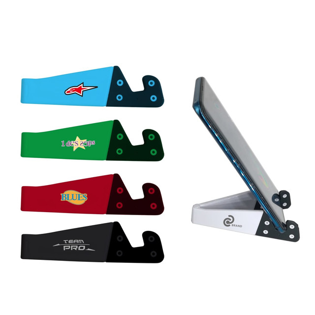 A V-shaped iPhone and iPad stand in assorted colours: blue, green, red, black, and white. Features a brand logo.