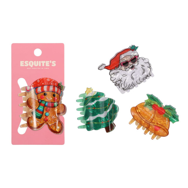 A set of three Christmas-themed hair claws in gingerbread, Santa, and Christmas tree designs, featuring vibrant colours.