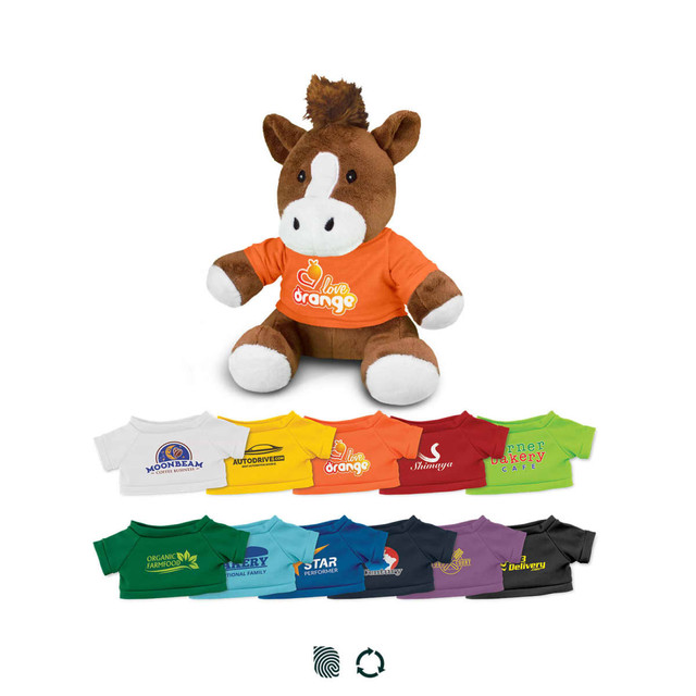 A brown horse plush toy wearing an orange shirt, alongside various colourful t-shirts in different hues.