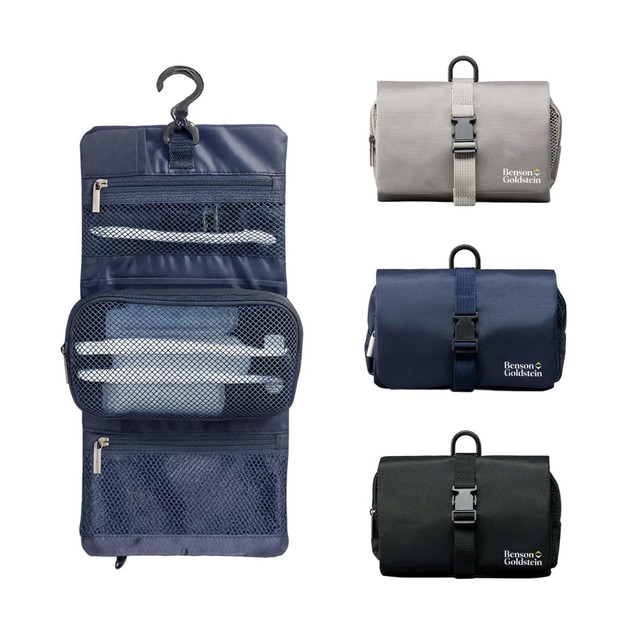 A folding travel toiletry bag in grey, navy, and black featuring zipper compartments and a hanging hook. It has a logo.