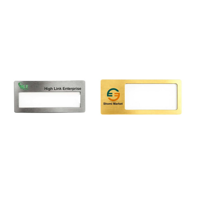 Two reusable metal name badges in silver and gold finishes, featuring a clear window for name display and logos.