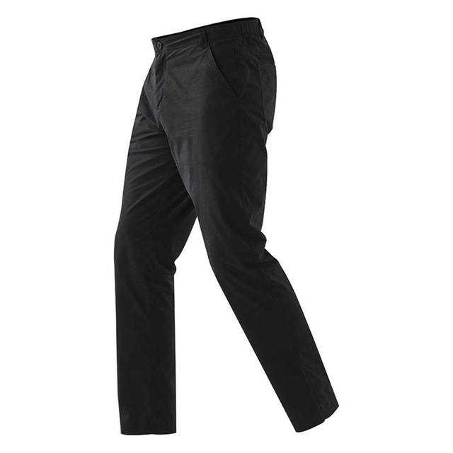 A pair of black performance track pants featuring pockets and an elastic waistband. Includes a logo.