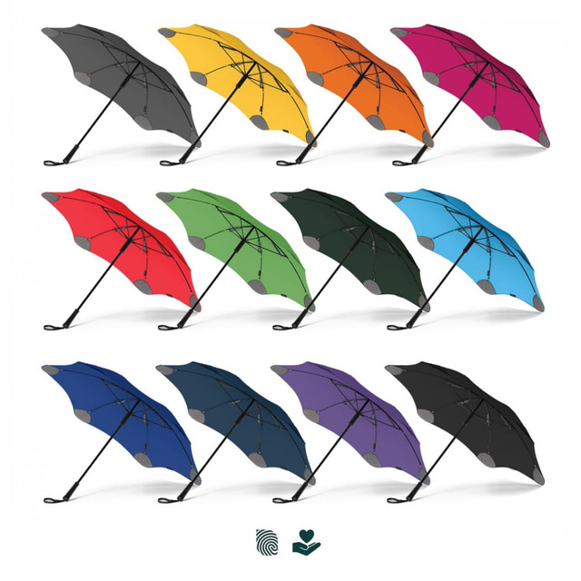 A selection of BLUNT Classic Umbrellas in various colours: black, yellow, orange, green, red, blue, dark blue, and purple. A selection of BLUNT Classic Umbrellas in various colours: black, yellow, orange, green, red, blue, dark blue, and purple.