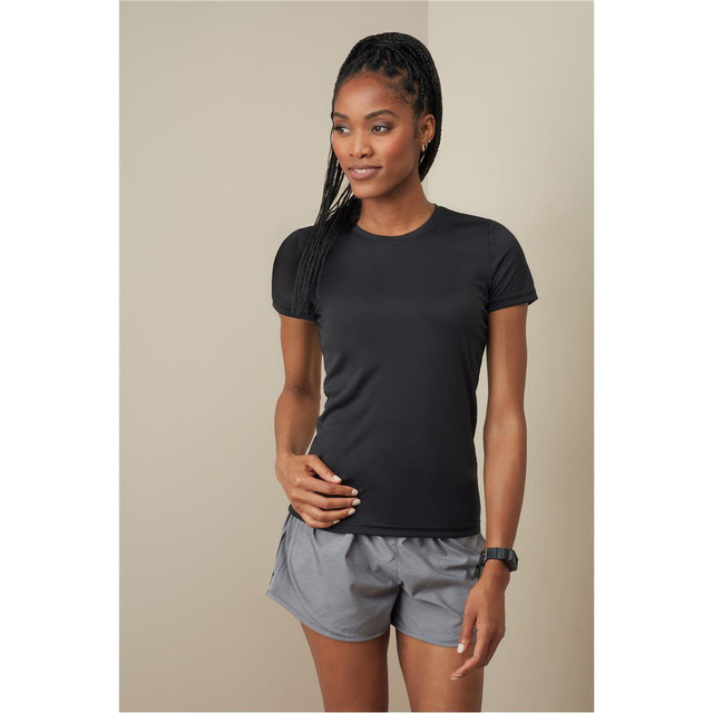 A black women's active sports T-shirt with short sleeves, paired with grey athletic shorts. The model is standing confidently.
