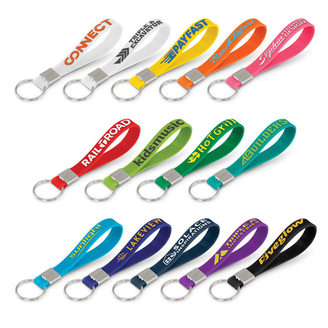 A collection of silicone key rings in various colours, each with an embossed design and a metal keyring attachment.