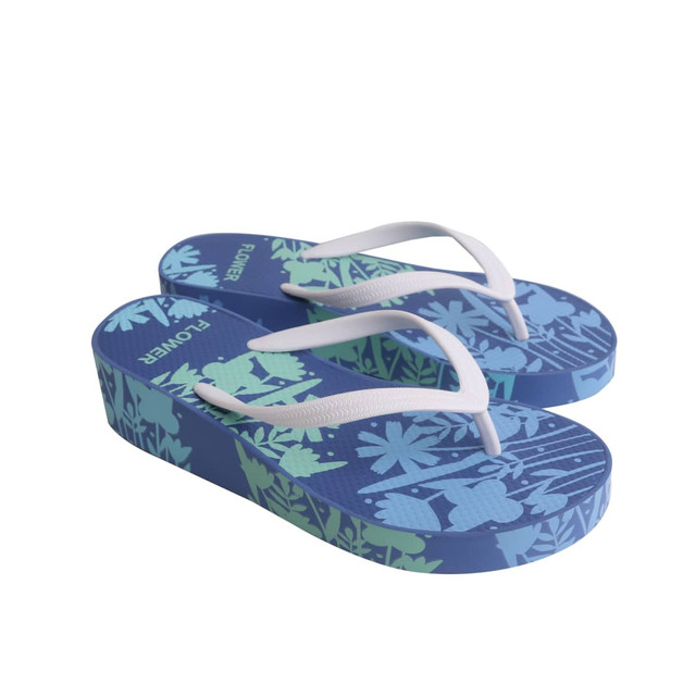 A pair of blue and green rubber platform thongs featuring a nature-inspired design and white straps.