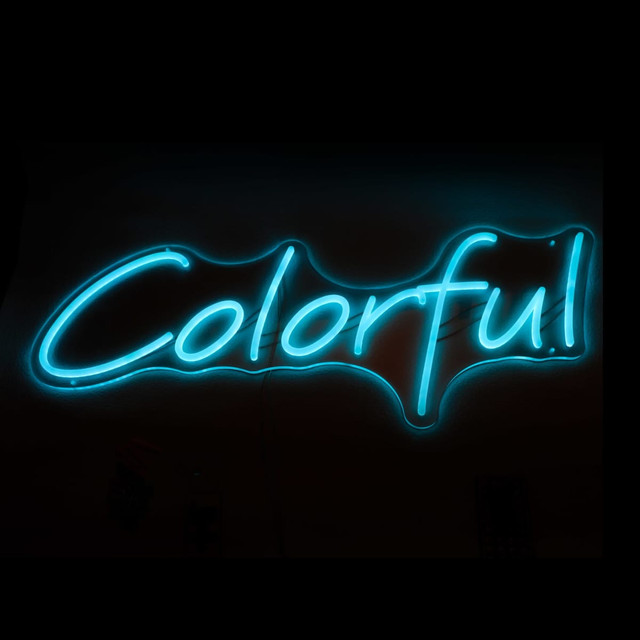 A neon LED sign featuring the word "Colourful" in bright blue light against a dark background.