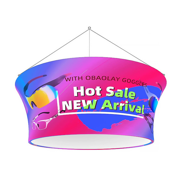 A circular hanging banner in vibrant pink and blue with sunglasses graphics and branding.
