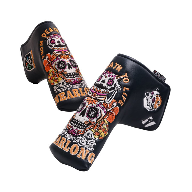 A black custom blade putter cover featuring colourful skull and floral designs, along with a logo.