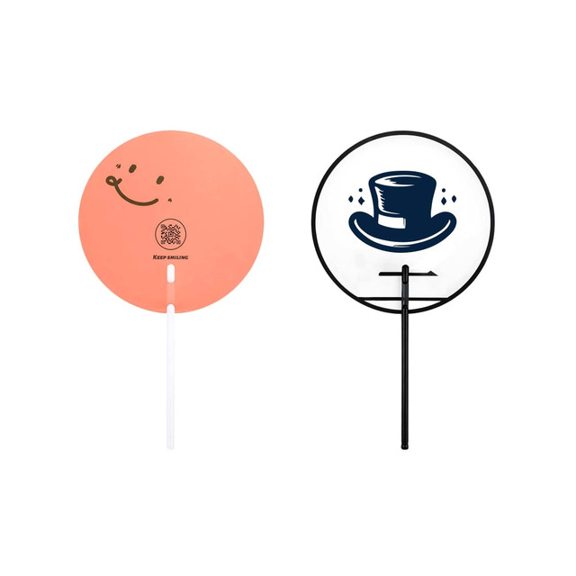 Two custom shape transparent PVC hand fans: one in peach with a smiley face, the other with a top hat design in black and white.