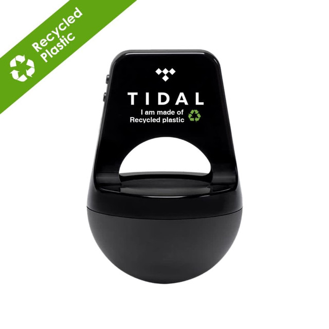 A black wireless speaker made from recycled ABS plastic, featuring a logo on the front.