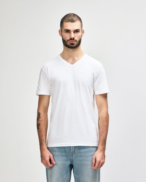 A white Gildan Softstyle adult V-neck T-shirt displayed on a male model, featuring a simple design and a branding logo.