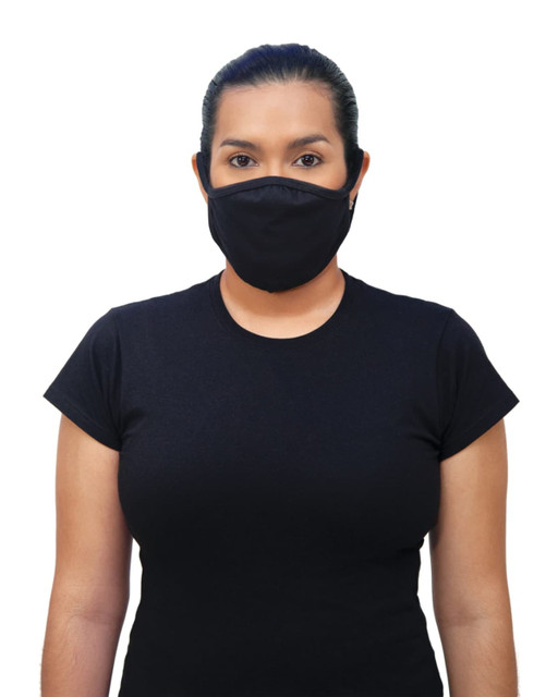 A woman wearing a black Gildan mask, featuring a logo, stands in a black t-shirt against a white background.